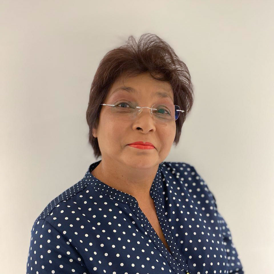 Zubeeda Lee Lum in a dark blue shirt with white dots